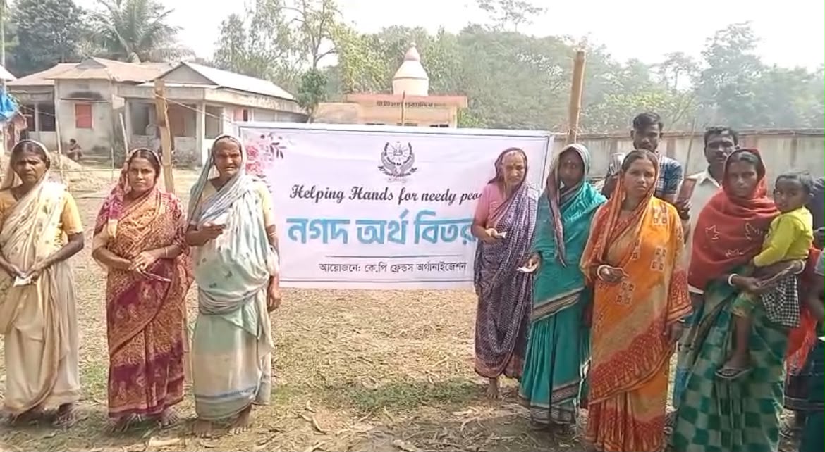 Women gathered at a KP Friends cash aid distribution
